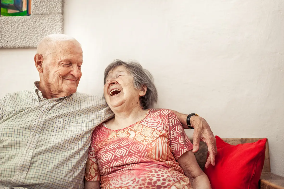 Couple happy on couch